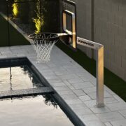 Night time swim playing basketball in the pool